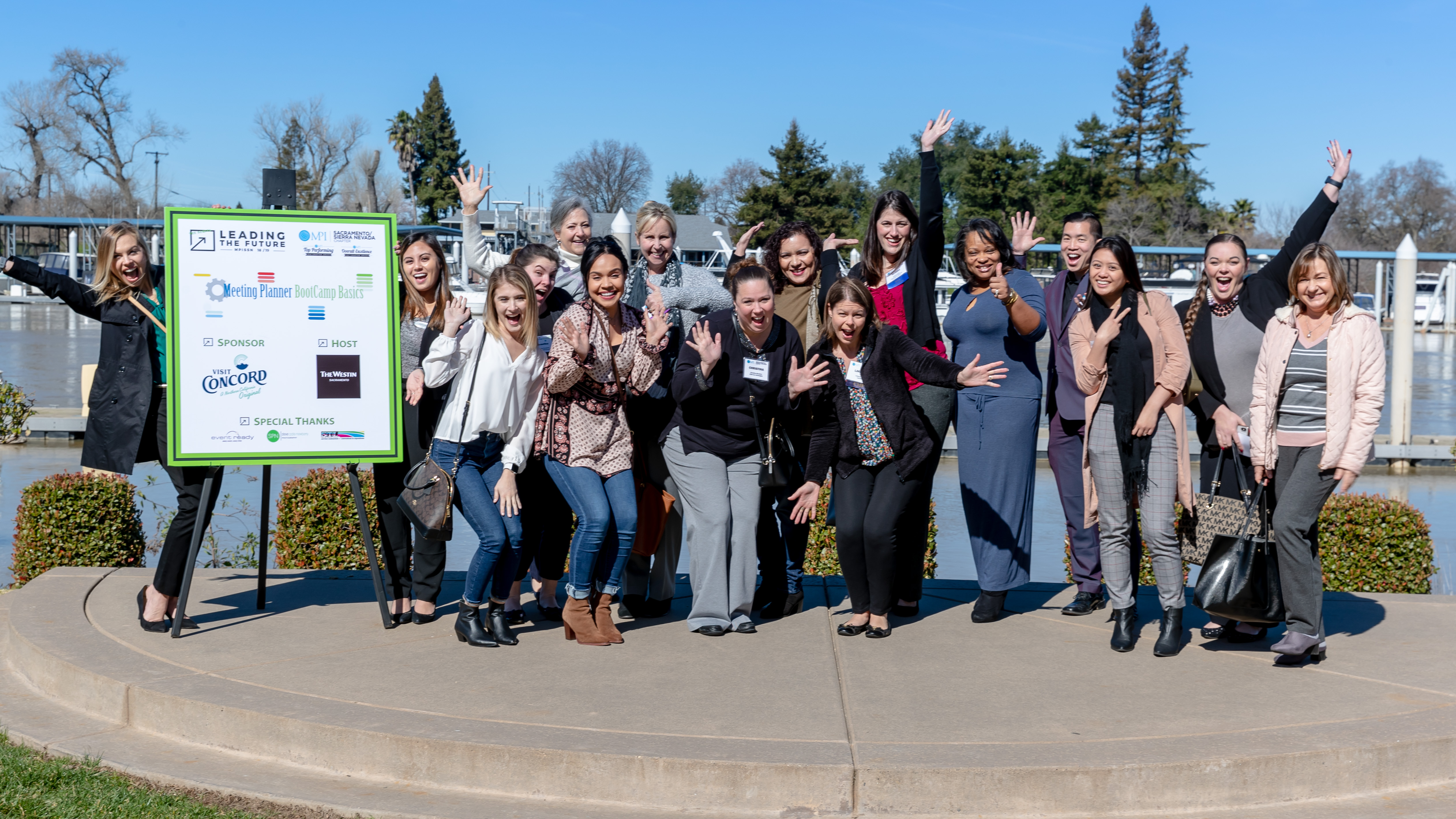 Group of planners smiling and waiving at the 2021 boot camp